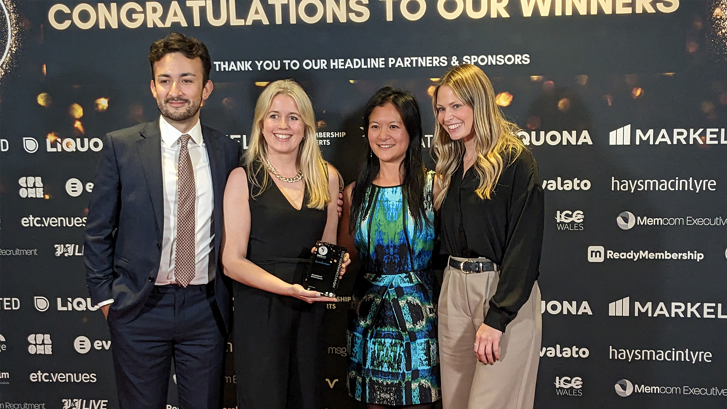 Memcom Excellence award winnders - Staff holding the award